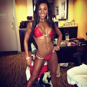 This is a red small Ravish Sands bikini competition suit.